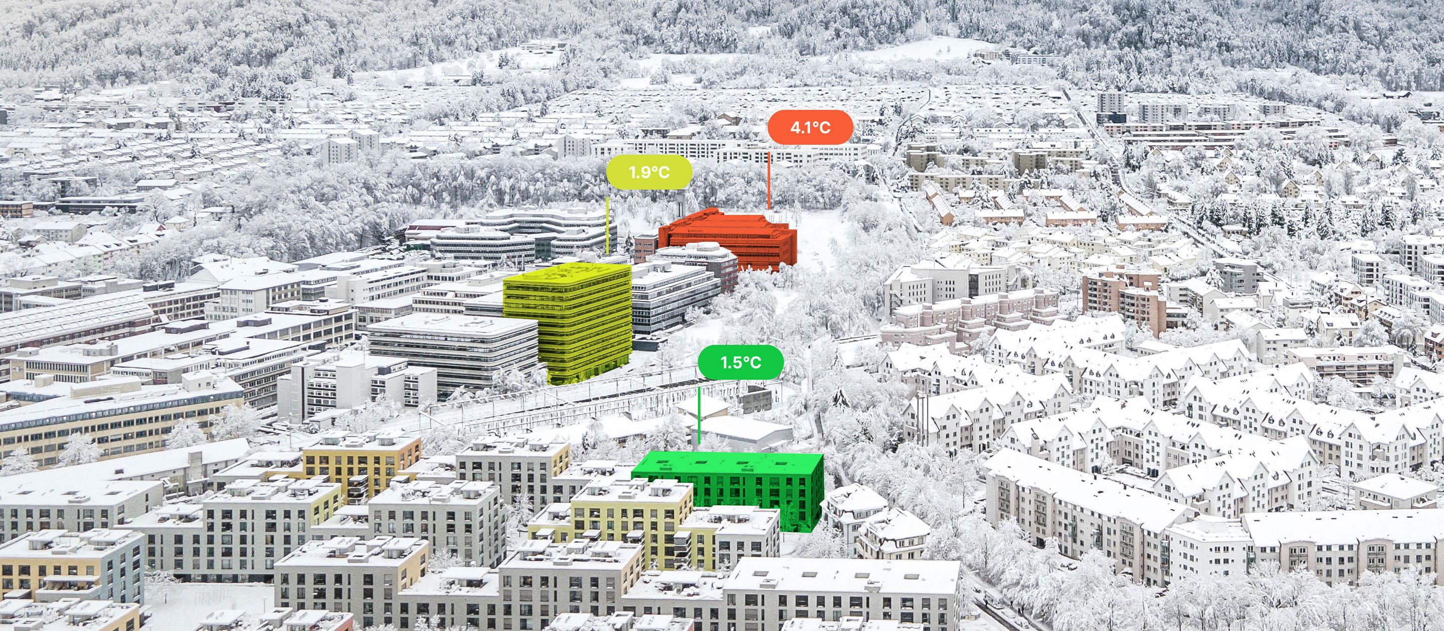 View of snow-covered buildings from above, three of them are coloured. One in red with the label 4.1°C, one in yellow with 1.9°C and a third in green with 1.5°C.