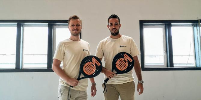Two Padelta founder-members in Rothenburg holding padel rackets